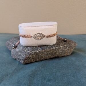 Adjustable Tan Bracelet With Leaf Design